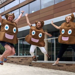 Three Big C employees trying our their poo emoji costumes before a fundraising event.