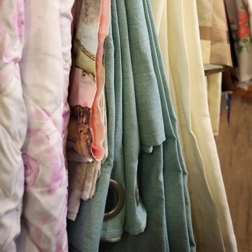A close up of clothes hanging up on a clothes rail