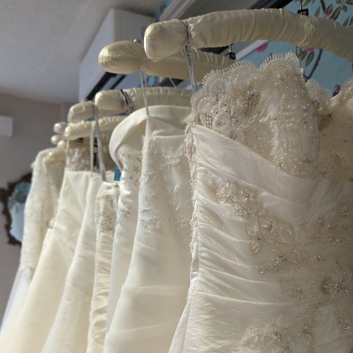 A rail of wedding dresses at the Big C timberhill shop