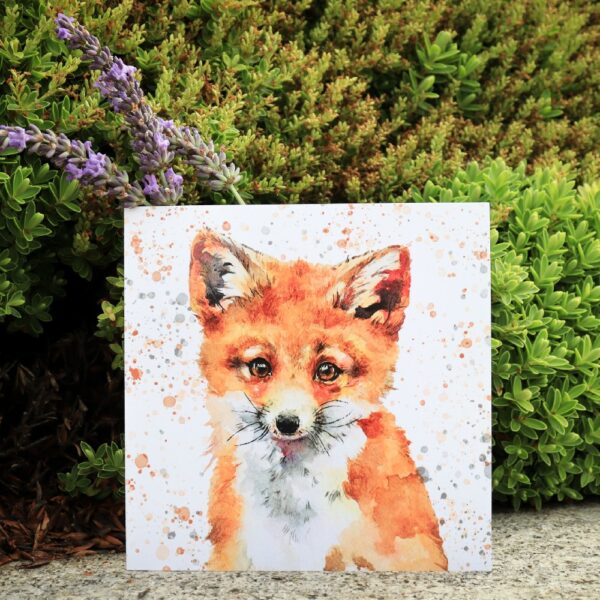 A greetings card with a painting of a fox's face and upper body