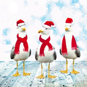 Three seagulls with Christmas hats and scarves on