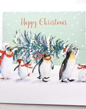 An illustration of four penguins carrying a xmas tree