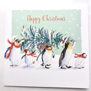 An illustration of four penguins carrying a xmas tree