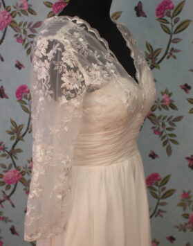 Detail of Lovely Wedding Dress. White, above knee