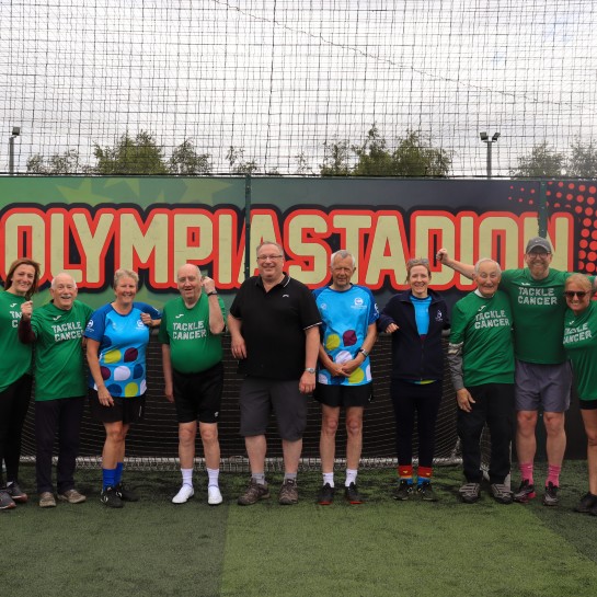 A group of people who have just completed a walking football session