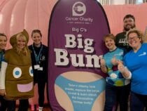 The Big C team standing by Big C's inflatable Big Bum